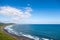 Wild beach made of volcanic sand on the Pacific Ocean, Kamchatka Peninsula, Russia.