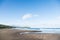 Wild beach made of volcanic sand on the Pacific Ocean, Kamchatka Peninsula, Russia.