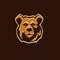 Wild brown bear head logo on dark background