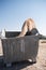 Wild camel eating out of a garbage dumpster in the middle east