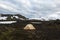 Wild camping in Iceland lava field with white cap.