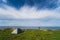 Wild camping in nature in Estonia in summer. Tent on the steep shore of the Baltic Sea in Paldiski