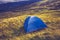 Wild camping with tent on mountain