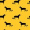 Wild cat silhouettes seamless vector pattern. Leopards, jaguar and cheetah shapes black on yellow repeating background