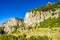 Wild coastline with green luxuriant vegetation and rocky cliffs over the Mediterranean sea at Amalfi Coast