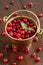 Wild cranberries in little brass bucket