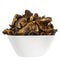 Wild and dried mushrooms placed in a white dish