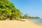 Wild and exotic Asian beach with colorful boat