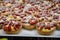 Wild fragolino strawberry and raspberry cakes in ancient city of strawberry Nemi, Castelli Romani, Italy close up