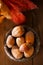 Wild hazelnut in iron bowls on wooden table