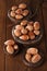 Wild hazelnut in iron bowls on wooden table