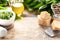 Wild leek pesto with olive oil and parmesan cheese in a white ceramic mortar on a wooden table. Useful properties of ramson. Copy