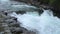 Wild mountain river water splashing in summer day