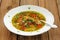 Wild mushroom and vegetable soup with chili in white plate