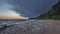 Wild northern beach with boulders and spruce forest on the Baltic Sea