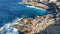 Wild ocean water from above - waves hitting the rocks