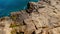 Wild Ocean water from above - Waves hitting the rocks