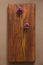 Wild onion violet on a wooden background of black walnut. Beautiful summer wildflowers. vertical, vertical design