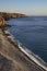 Wild pebble beach near Playa San Juan towards the banana plantations on the top of the rough cliffs, Tenerife, Canary Islands