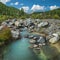 Wild river in the mountains of Siberia. A stormy stream, stones, summer