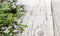 Wild rosemary with flowers on the old wooden table