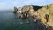 Wild sand deserted beach Ursa on resort Cabo da Roca picturesque cape westernmost point of Sintra mountain range hills