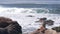 Wild seals rookery, sea lions resting on rocky ocean beach, California wildlife.