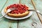 Wild strawberry tart with cottage cheese served with vintage for