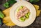 Wild Trout with braised cucumber in plate on old wooden table