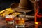 The Wild West concept theme with cowboy hat, rope lasso, leather gloves, two glasses of whiskey on the rocks and bottle of bourbon