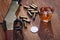 Wild west rifle and ammunitions with glass of whisky and ice with old silver dollar on wooden table