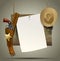 Wild West wood signboard with a sheet and cowboy accessories suspended on a rope