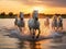 Wild white horses of Camargue running on water at Southern