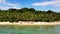 Wild white sand beach with coconut trees. Caramoan Islands, Philippines.