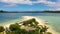 Wild white sand beach with coconut trees. Cotivas Island Cottage. Caramoan Islands, Philippines.