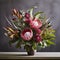 Wild Wonder: A Bold Bouquet of Protea, Thistles, and Aspidistra Leaves