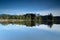 Wilder Kaiser mountain range reflected in a mountain lake