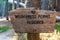 Wilderness permit required sign on the wooden post in the national forest