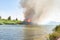 Wildfire burning in reeds next to the Riet River