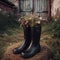 Wildflowers are inserted into to high black rubber boots.