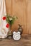 Wildflowers, red poppies in an old brass jug on an old wooden table, white alarm clock, white silk drapery, concept of time, Dutch