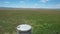 Wildflowers and water tank at Carrizo Plain National Monument and Soda lake