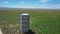 Wildflowers and water tank at Carrizo Plain National Monument and Soda lake