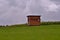 Wildlife observation cabin in hilly cornfield