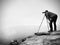 Wildlife photographer on mountain summit works. Man like to travel and photography, taking pictures