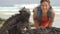 Wildlife photographer and tourist on Galapagos taking photo of Marine Iguana