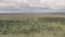 Wildlife vacation, driving through a game reserve in Laikipia, Kenya. Aerial drone view of African