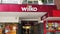 Wilko main entrance sign logo at 78-102 Broadway, Stratford, London.