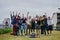 We will graduate together guys. Portrait of a group of young students jumping with joy in the air outside in a park