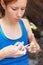 This will help immensely with her grip. Closeup of a rock climber taping her fingers.